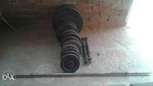 Gray Metal Barbell Bar And Weighting Plate Lot