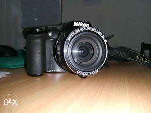 Nikon Coolpix Black SLR camera.