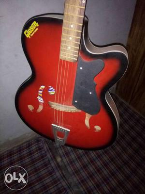 Red And Black Gibson Jazz Acoustic Guitar