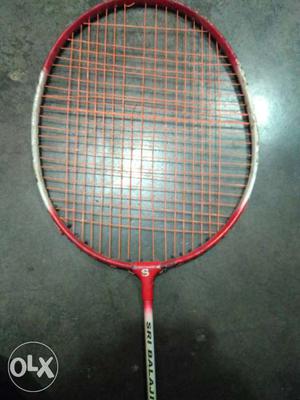 Red Badminton Racket. Only you need to change the string.