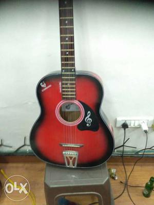 Red and black pure acoustic guitar, amazing looks