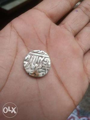 This coin is very antique. Urdu language have