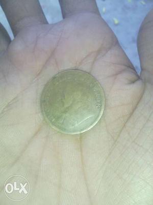 This is an 99 years old quarter Anna Indian coin