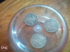 Three 25 paise coins of year  and 