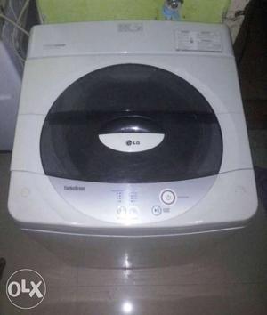 White And Black LG Top-load Clothes Washer