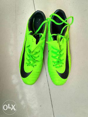 Green-and-black Nike Cleats