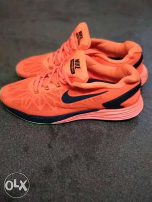 Pair Of 9.5 Orange Nike Shoes