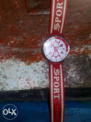 Round White Chronogrpah Watch With Red Strap