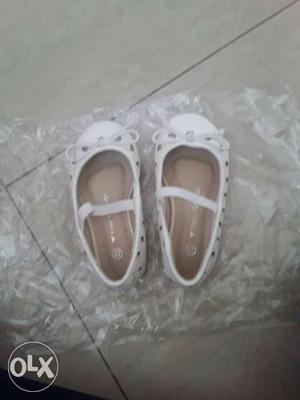 White brand new shoes for baby girl