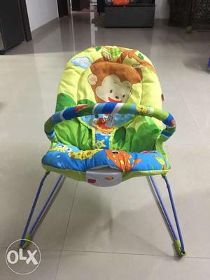Baby's Green, Blue, And Brown Fisher-Price Bouncer