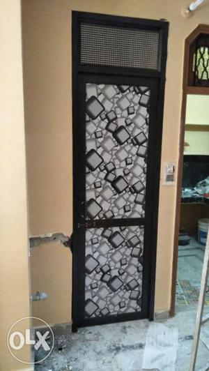 Black And Grey Wooden Panel Door