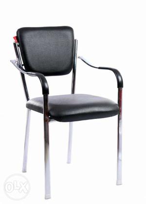 Black Leather Padded Black And White Metal Base Armchair