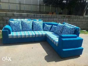 Blue And White Suede Sectional Couch With Throw Pillows