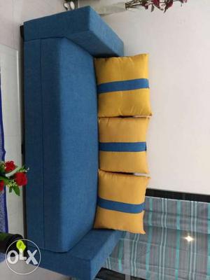 Blue Fabric Sofa With Five Pillows