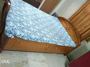 Brown Wooden Bed Frame With Blue Floral Bed Mattress