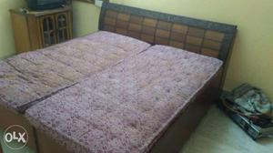 Brown Wooden Bed Frame With Tufted Mattress