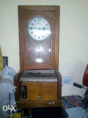 Brown Wooden Framed Pendulum Clock