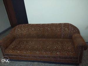 Brown colour sofa set with center table