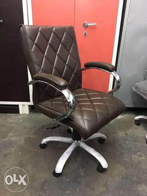 Gray Metal Base With Quilted Black Leather Rolling Armchair