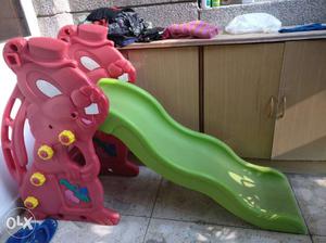 Green And Red Plastic Slide