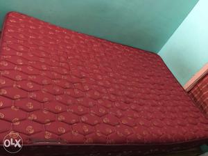 Quilted Red Mattress & Wooden Cot for sale