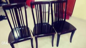 Three Black Wooden Chairs