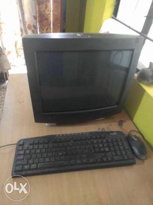 Black CRT Computer Monitor, Keyboard, And Mouse
