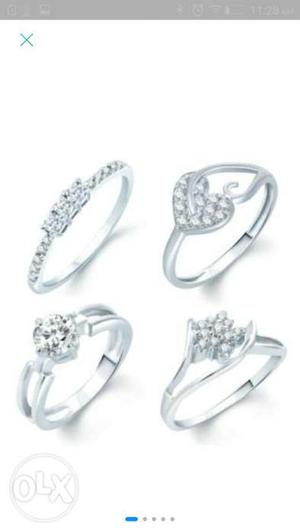 Four Silver-colored Engagement Rings