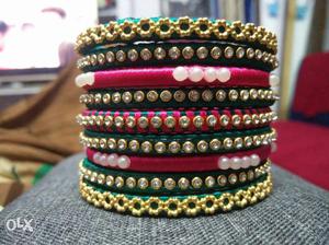 Gold-colored And Pink Silk Bracelets