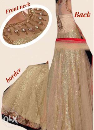 Golden gown with red border n dupatta.