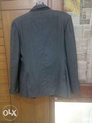Grey colour raymond suit.. in a good condition