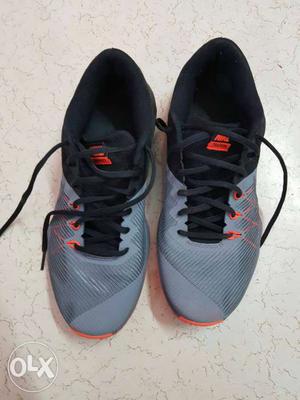 Pair Of Gray-and-black Nike Running Shoes