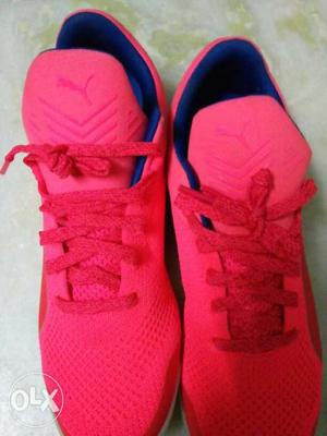 Pair Of Pink Puma Running Shoes