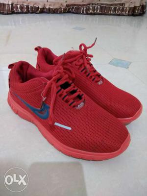 Pair Of Red Nike Running Shoes