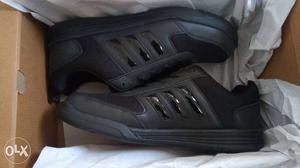 Pair of Adidas black shoe unused