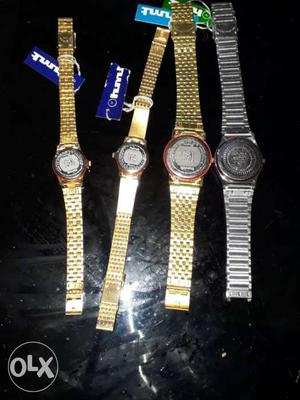 Three Round Gold- And One Silver-colored Watches With Link