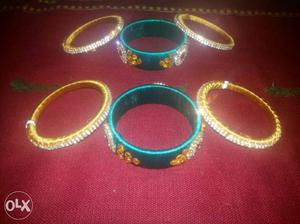 Two Blue And One Green Beaded Bracelets