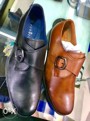 Two Brown And Black Leather Shoes