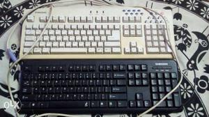 Two White And Black Samsung Computer Keyboards