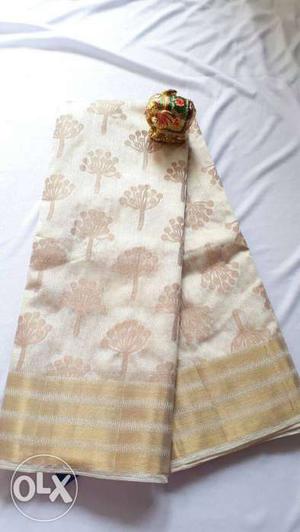 White And Brown Floral Textile