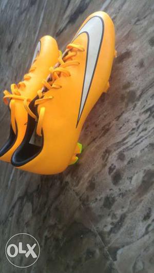 Yellow-and-gray Nike Cleats Shoes