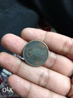 It's a Anna indian coin of 1rs of year 