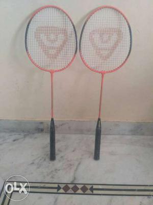 Two Black And Yellow Badminton Rackets