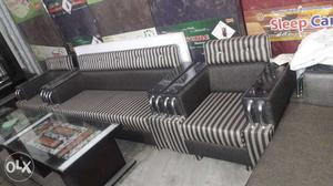 Black Leather Framed Gray And Black Striped Padded Sofa Set