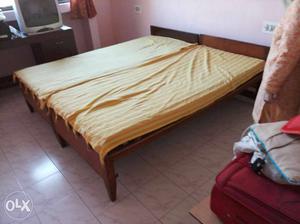 Brown Wooden Bed Frame With Mattress And Covers