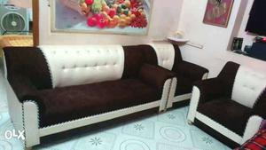Brown-and-white Couch And Two Armchairs
