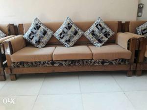 Brown n creme teak wood sofa with cushions n