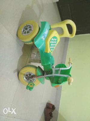 Green And Yellow Plastic Trike