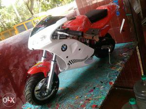 Red and white color BMW Pocket Bike for kids only below 12