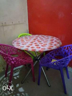 Round Red And White Metal Table With Chairs